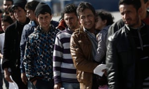 Refugees and migrants arrive at the port of Piraeus near Athens.