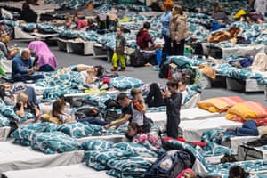 Russia-Ukraine war latest: No casualty toll yet after Russian bombardment of Mariupol theatre, says official – live 3 A reception point for refugees from Ukraine organised in a sports hall gymnasium in Wroclaw, Poland
