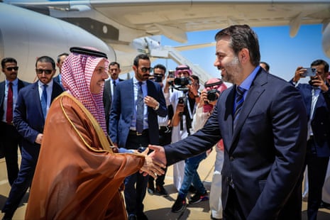 Syria’s interim foreign minister Asaad al-Shaibani (R) receiving Saudi Arabia’s foreign minister Prince Faisal bin Farhan Al Saud (L) at Damascus international airport on Saturday.
