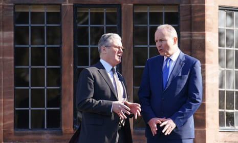 British prime minister Keir Starmer (L) and Irish taoiseach Micheál Martin (R) converse in the gardens during the UK-Ireland Summit 2025 at Inglewood Manor House in Ellesmere Port, Liverpool.