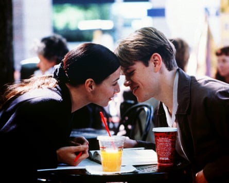 Woman and man kiss at table