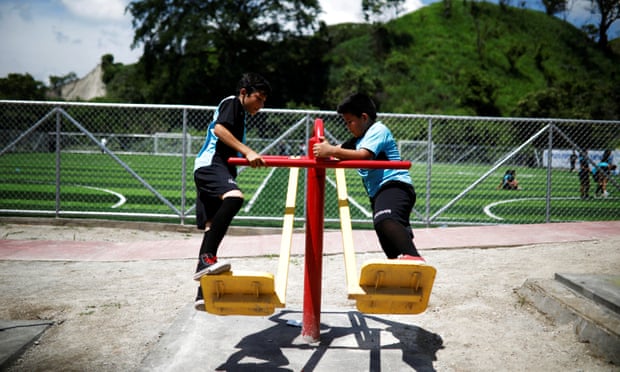 Children play at a new sports complex at La Campanera neighborhood in Soyapango, El Salvador