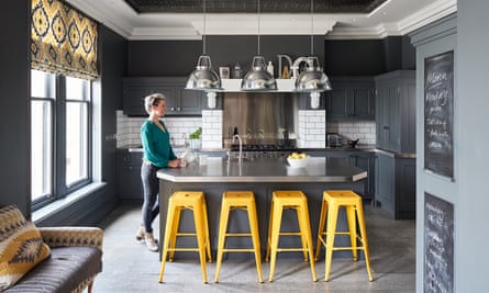 Creative space: Ann Marie in the kitchen, with its aluminum worktop, yellow Wayfair stools and BTC pendant lights.