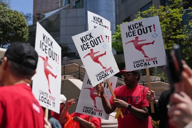 people hold signs that read ‘kick ice out’