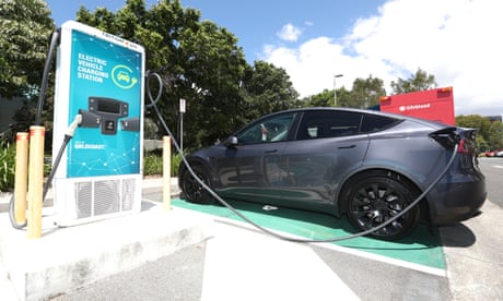 Electric car charging at a charging station