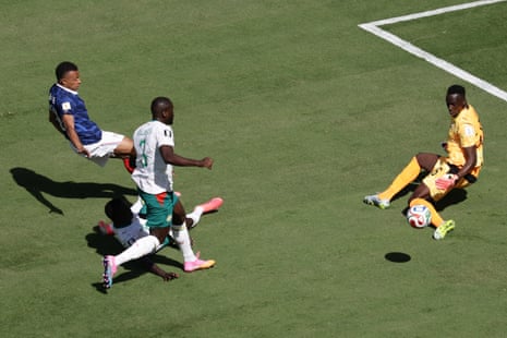 Senegal keeper Edouard Mendy saves a shot by France's Kylian Mbappe.
