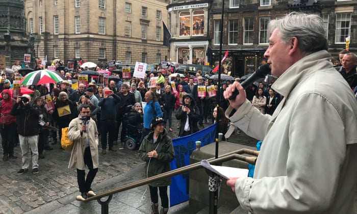 The Scottish Labour leader, Richard Leonard, speaks to protesters in Edinburgh.