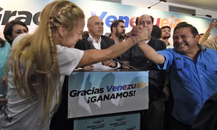 Lilian Tintori, the wife of jailed Venezuelan opposition politician Leopoldo Lopez, celebrates as she learns the early results.