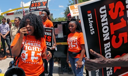 Noji Olaigbe, left, from the Fight for $15 movement, speaks during a workers’ strike at a McDonald’s in Fort Lauderdale in May 2019.