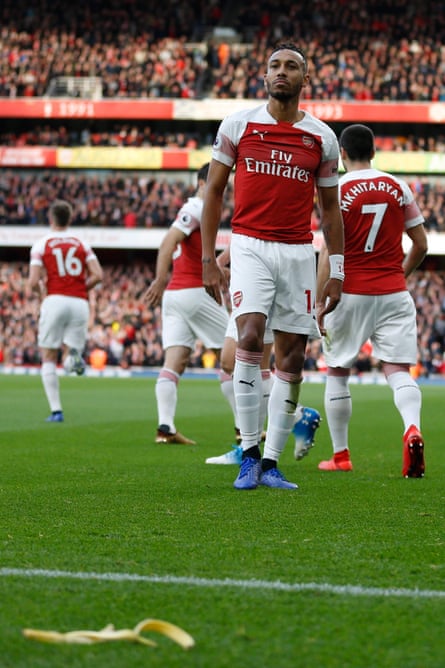 December 2: A banana thrown from Tottenham section lies on the pitch as Arsenal’s Gabonese striker Pierre-Emerick Aubameyang looks on.