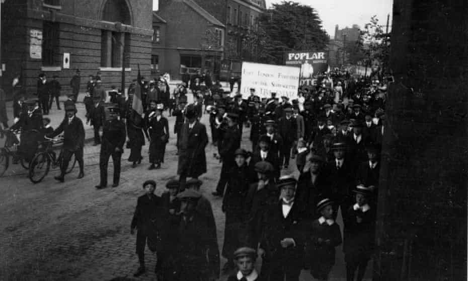 An East London Federation of Suffragettes march passes Bow bus station, June 1914.