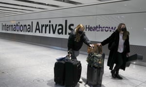 Travellers arrive at Heathrow Airport in London, Sunday, January. 17.
