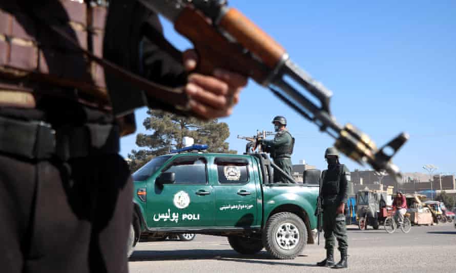 Afghan security officials at a checkpoint last week. Two judges were killed in an early morning ambush in Kabul on Sunday.