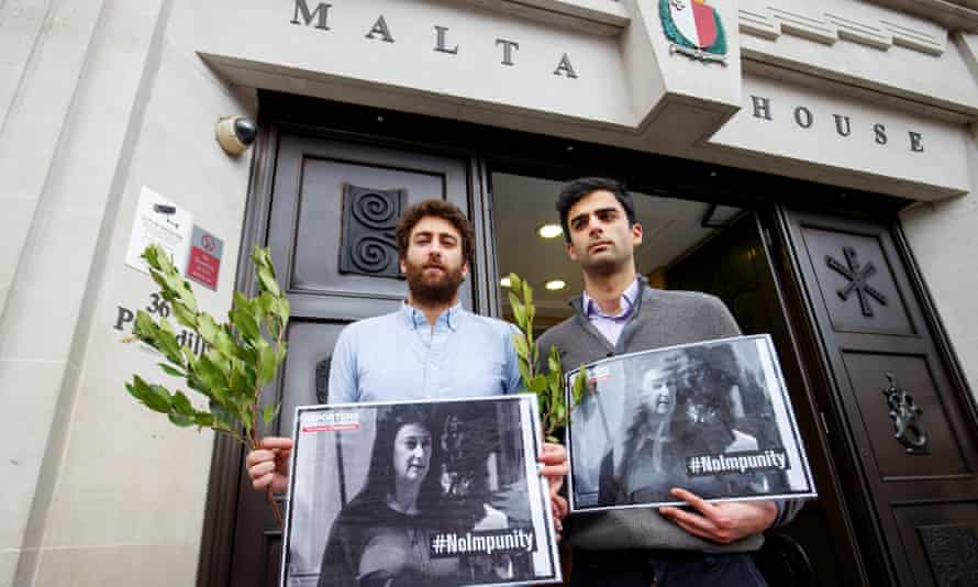 Matthew Caruana Galizia (left) and Paul Caruana Galizia, the sons of the murdered Maltese journalist Daphne Caruana Galizia, attend a vigil outside the Maltese high commission in London, six months after she was assassinated.