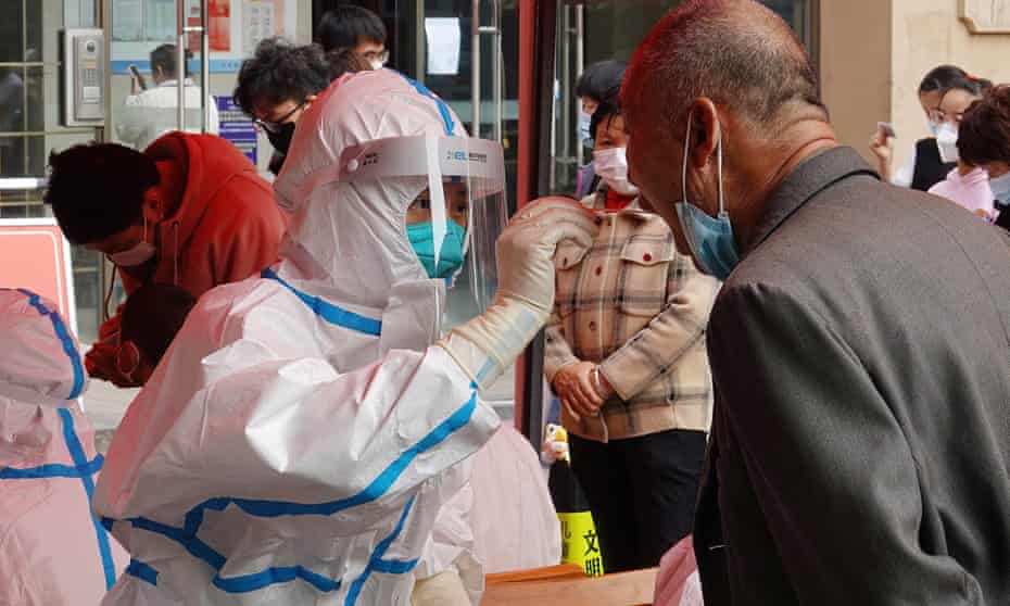 A resident is tested for Covid in Changzhou, China