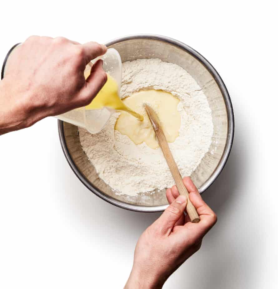 Felicity Cloake’s perfect cardamom buns – step 3b. Whisk together the flours, salt, sugar and yeast in a large bowl or food mixer, and then, once it’s cool enough,then add the milk and butter once it’s cool enough.