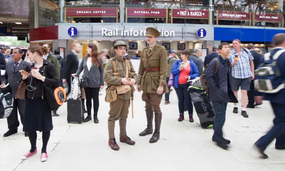 Soldiers stand in Waterloo station