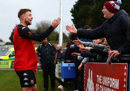 Connor Riley-Lowe celebrates with fans after a 3-2 win over Welling at Truro City Stadium in March