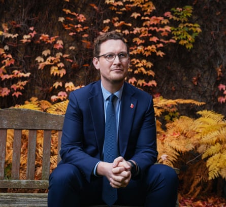 Darren Jones on a bench in a garden Darren Jones on a bench in a garden