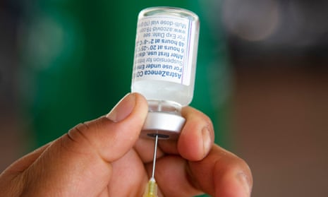 A nurse prepares a dose of the AstraZeneca vaccine