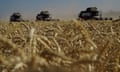 Farmers harvest wheat in the Russia’s Rostov region, near the border with Ukraine.
