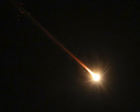 Israeli air defences intercept a projectile over northern Israel, as seen from Majdal Shams in the Israeli-annexed Golan Heights, on Tuesday
