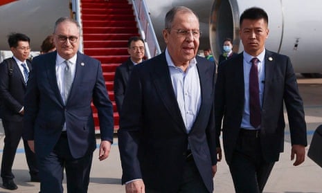 In this photo released by Russian Foreign Ministry Press Service on Monday, April 8, 2024, Russian Foreign Minister Sergey Lavrov, center, walks from the plane upon his arrival in Beijing, China.