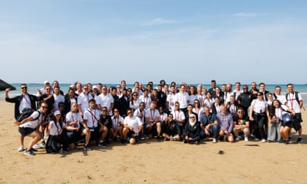The Refugee Olympic Team on a beach in Normandy.