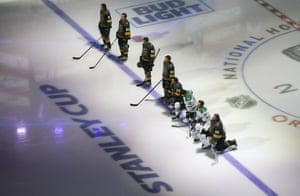 Dallas Stars’ Jason Dickinson (18), Tyler Seguin (91) and Vegas Golden Knights’ Ryan Reaves (75) and goalie Robin Lehner (90) take a knee for Black Lives Matter prior to an NHL hockey playoff game in Edmonton, Alberta, on 3 August