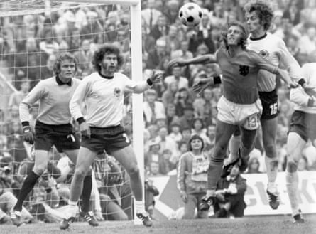 West Germany goalkeeper Sepp Maier and Paul Breitner look on as their teammate Rainer Bonhof and the Netherlands’ Johan Neeskens go up for a header during the 1974 World Cup final.