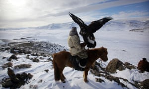 Human Planet … a Kazakh hunter with the golden eagle he has trained to hunt foxes.