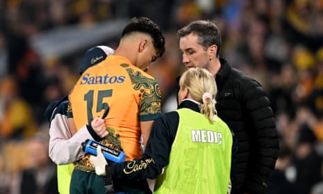Australia's Jordan Petaia has to leave the field with a head injury in the opening minutes against England