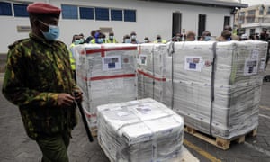 A Kenyan soldier guards a consignment of 182,000 AstraZeneca vaccines in Nairobi. UNICEF says poorer nations last month rejected more than 100m doses of Covid-19 vaccines.