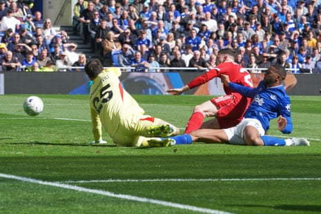 Everton's Beto, right, scores his side's first goal.