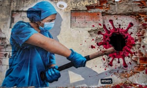 A street art mural entitled ‘Angels On Earth’, depicts nurse Sofia hitting the coronavirus with a baseball bat on 24 February 2021 in Vila Nova de Gaia, Portugal.