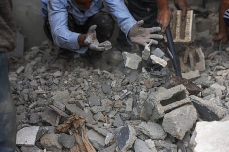 Palestinians search for survivors and casualties in the rubble of the Abu Nadi home which was hit in an Israeli strike west of Jabalia in the northern Gaza Strip on June 23, 2025.