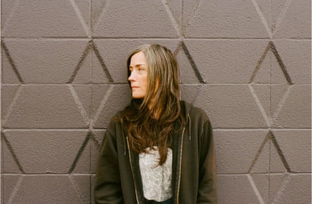 Liz Harris standing against a wall