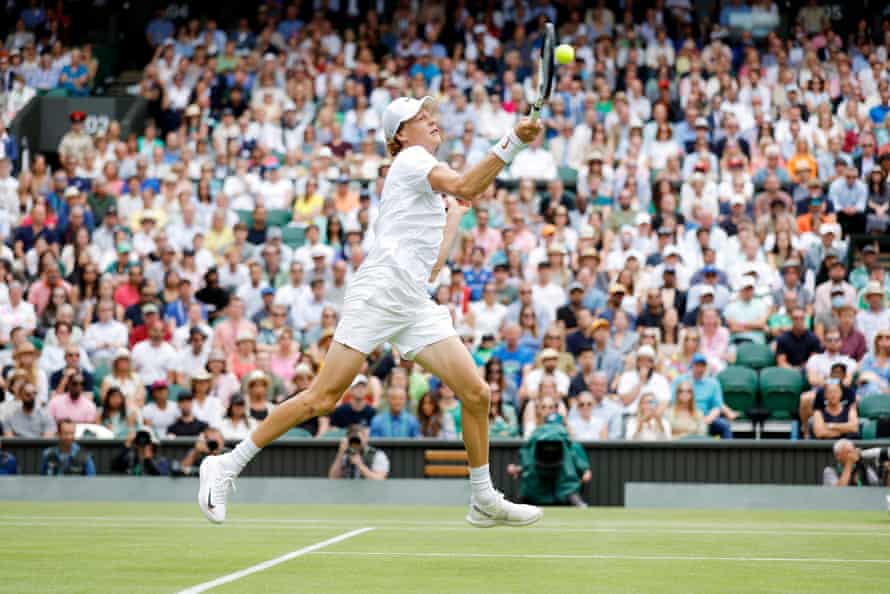 Jannik Sinner fires a forehand during his defeat to Novak Djokovic.