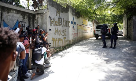 Gunmen assassinate Haitian president at his home, in Port-au-PrinceJournalists gather next to police officers standing guard near the private residence of Haiti’s President Jovenel Moise after he was shot dead by gunmen with assault rifles, in Port-au-Prince, Haiti July 7, 2021. REUTERS/Estailove St-Val NO RESALES. NO ARCHIVES