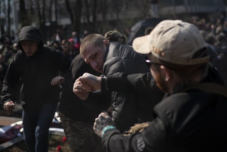 Nationalists fight with pro-Russian supporters at the Soviet-era monument to Gen Nikolai Vatutin in Kiev
