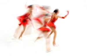 A multiple exposure picture of Alina Zagitova (OAR) in action during the figure skating team event.