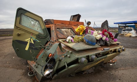 A damaged Ukrainian armoured personnel carrier (APC) with flowers on it put by local people in memory of the Ukrainian soldiers who died at this checkpoint, in the recently recaptured territory of the Kupiansk district, Kharkiv region, northeastern Ukraine.