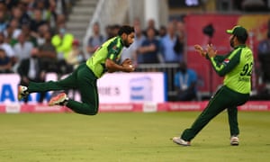 Haris Rauf dives to catch Moeen Ali.