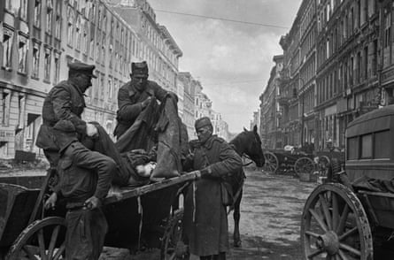Unloading a wounded soldier at the field hospital in Friedrichstrasse. Berlin, Germany, May 1945
