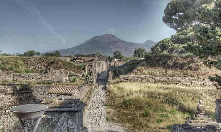 The archaeological site of Pompeii, with Mount Vesuvius looming over it.