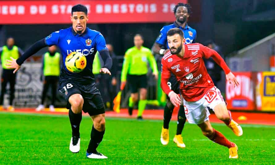 Brest forward Franck Honorat fights with William Saliba for the ball.