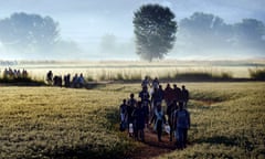 Syrian refugees in frosty field