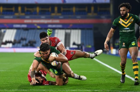 Latrell Mitchell touches down for Australia’s fourth try.