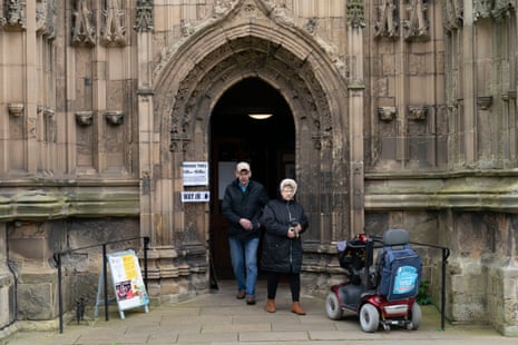People leaving a polling station after casting their vote today in Bridlington Priory church, east Yorkshire.