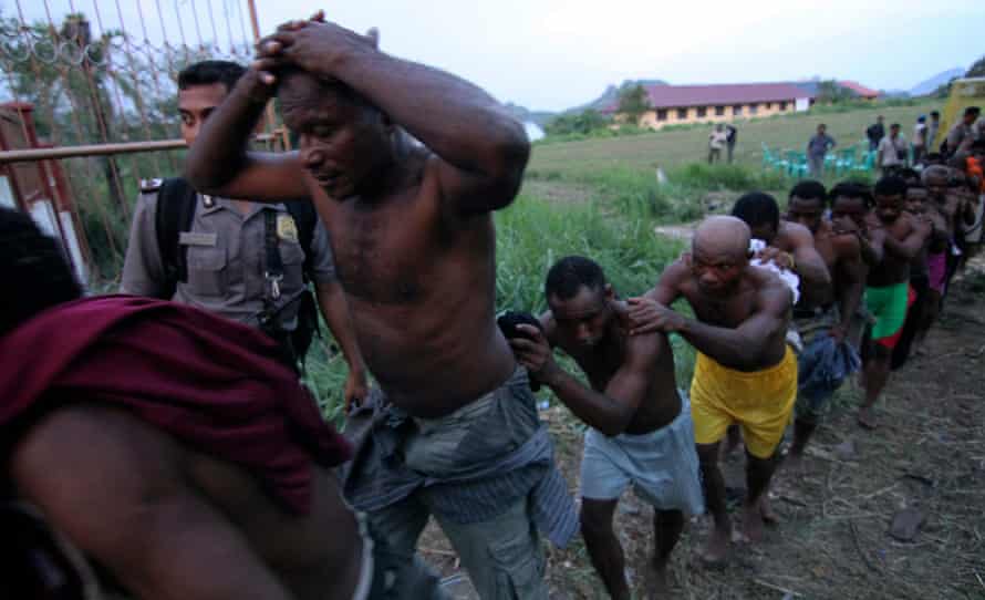 Police arrest attendees of the Third Papuan People's Congress in Abepura in Papua province in 2011.